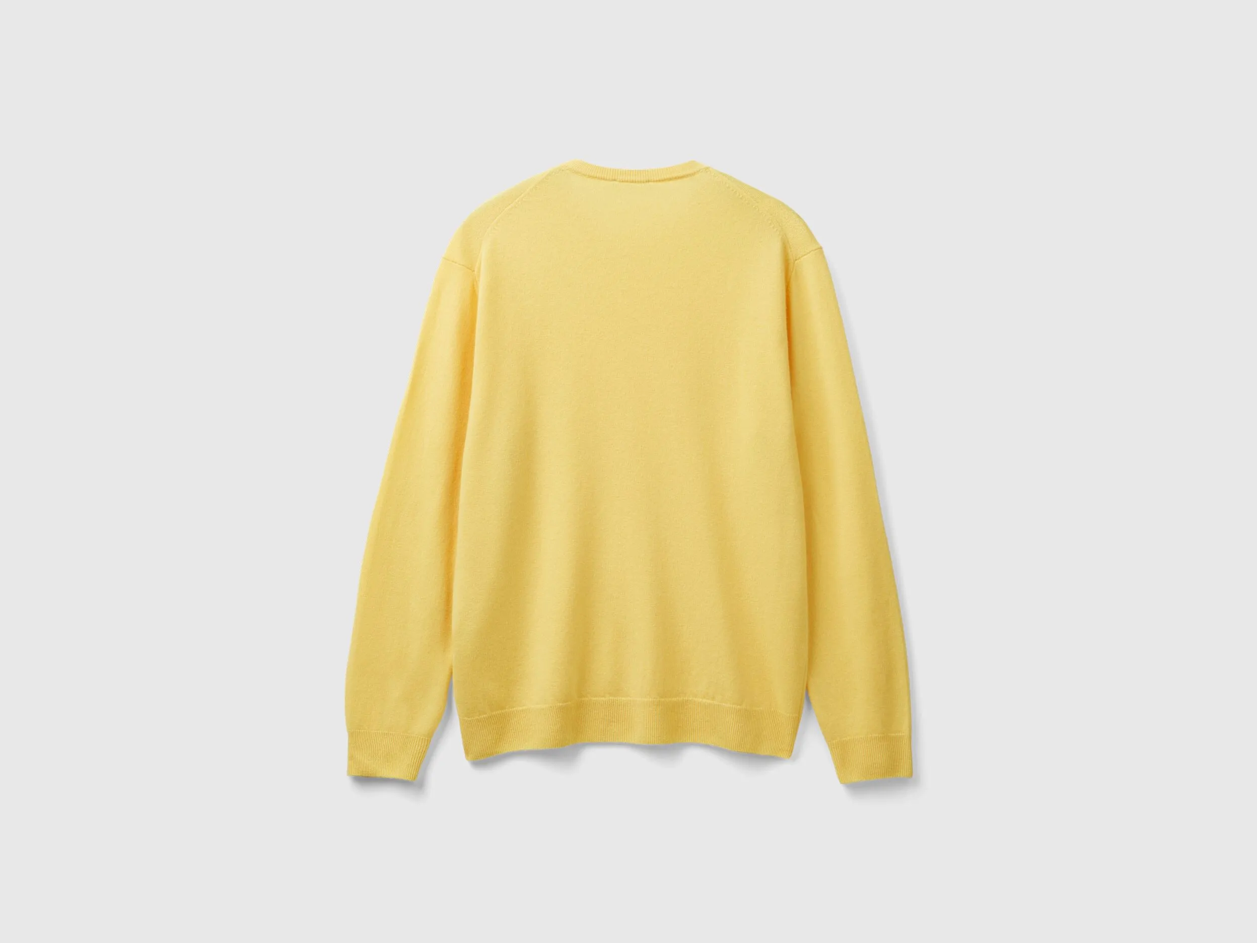 Yellow crew neck sweater in pure Merino wool - Yellow | Benetton